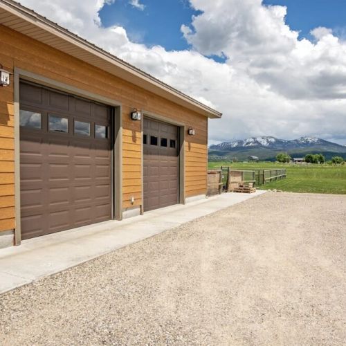 Keep your vehicles and gear dry using this spacious 2-car garage.
