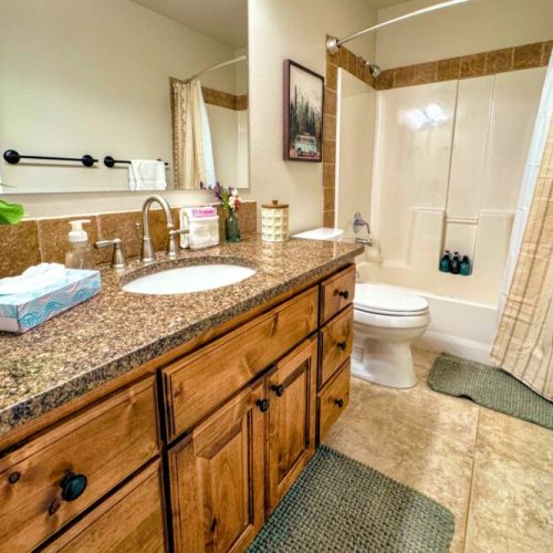 The main floor living area, as well as Bedrooms #2 and #3, share this full bathroom.