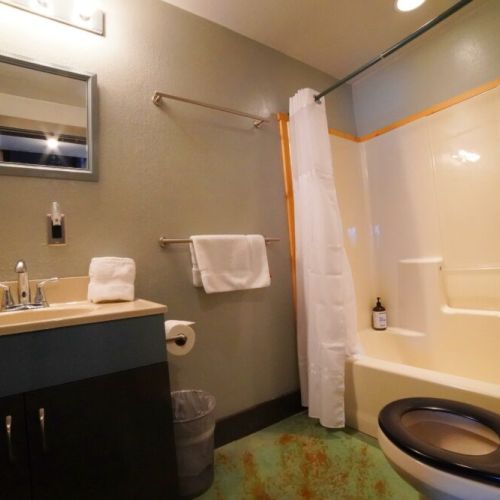 Both ground-floor bedrooms share a bathroom, which comes equipped with a tub/shower combo.