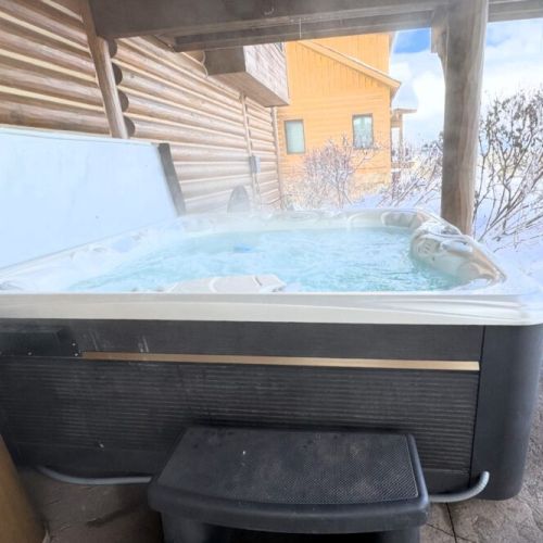 Step outside the bunk bedroom and jump into the luxurious hot tub.