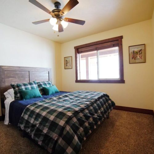 Bedroom #3 also enjoys a queen bed, a closet, and excellent natural light.