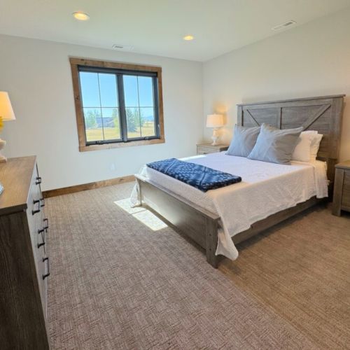 Bedroom #2 enjoys a queen bed and a walk-in closet, as well as access to a Jack-and-Jill-style bathroom.