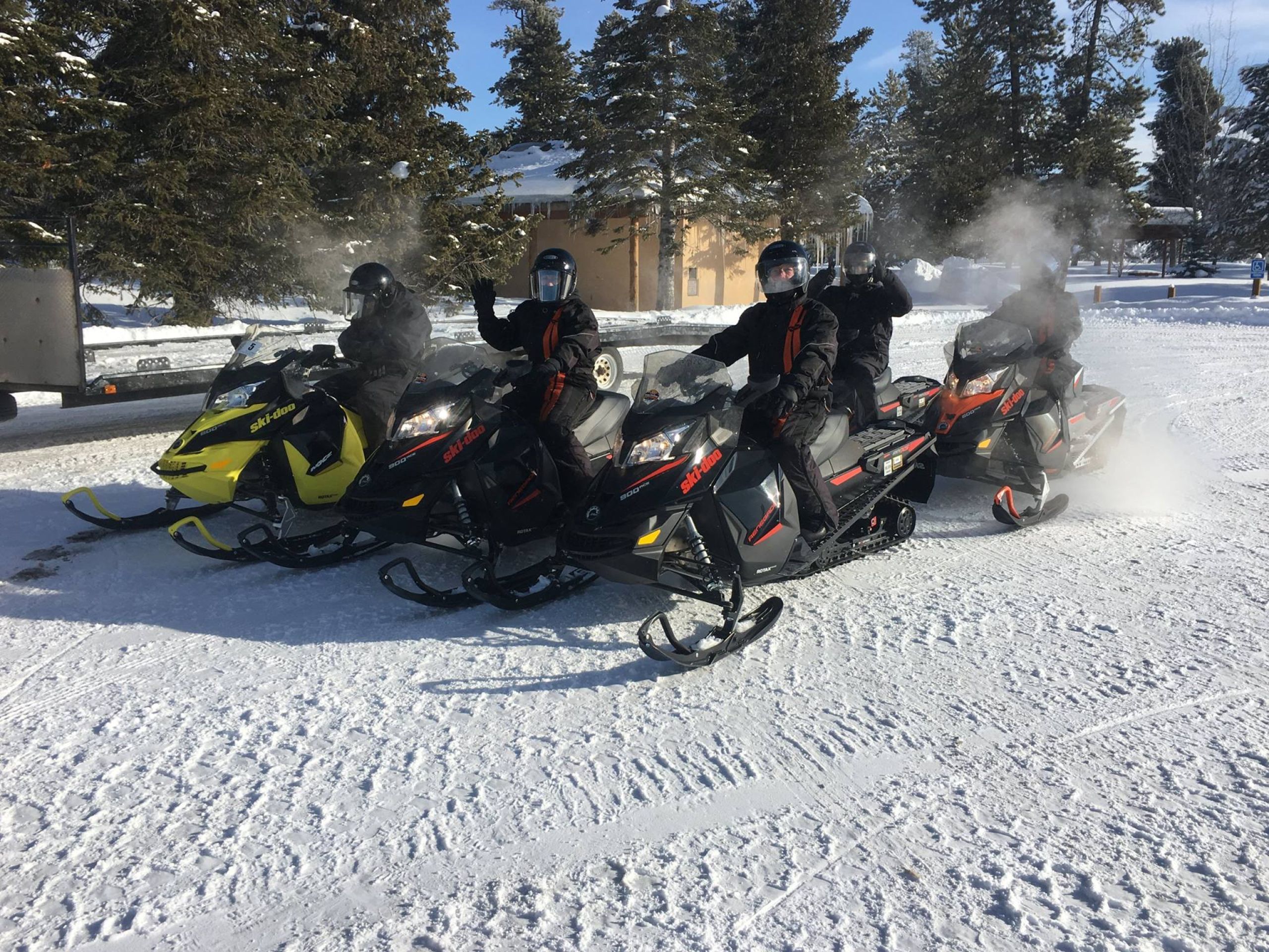 A group of snowmobilers on a Teton Valley snowmobile tour.