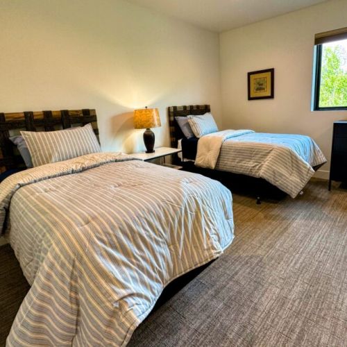 Bedroom #5 (upstairs) comes with 4 twin beds — perfect for kids! The room also enjoys an en suite.