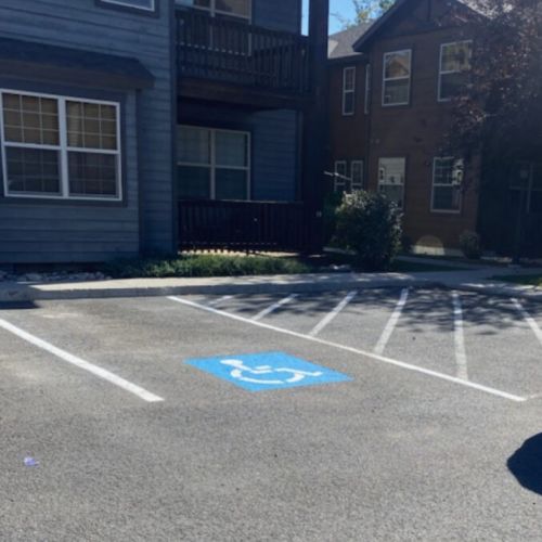 An accessible parking space is located near to the condo.