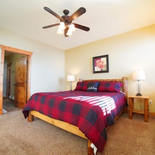 The master bedroom has a king bed, lots of natural light, and an en suite bath.