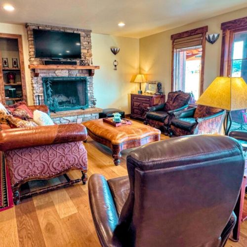 Kick back and relax in the living room, taking advantage of the cozy seating and a large TV.

(Firewood is not provided.)