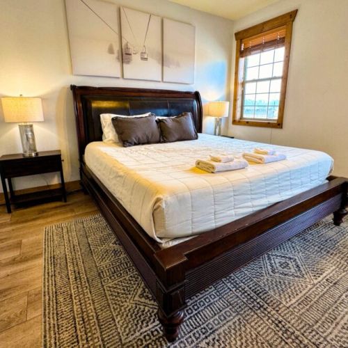 The master bedroom enjoys a king bed and an en suite bath.