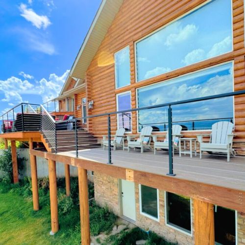 The expansive back deck is the perfect place to hang out with family, cook on the grill, and enjoy the spectacular view.