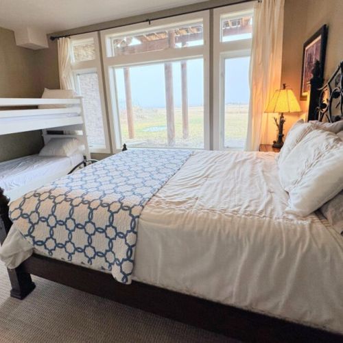 Bedroom #4 has a queen bed and a twin-over-twin bunk.