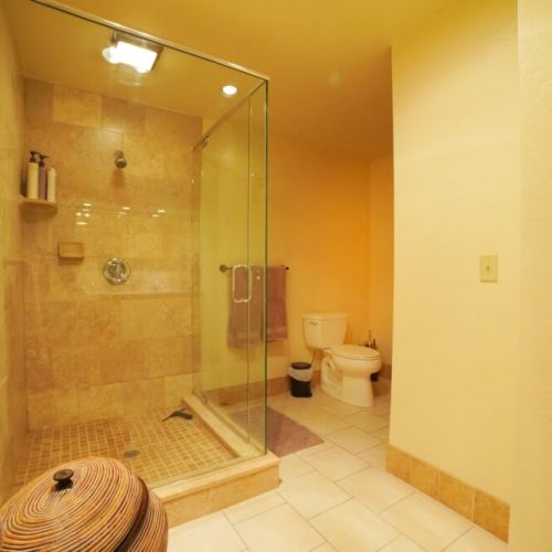 The basement enjoys a full bathroom, complete with a double vanity and a lovely walk-in shower.