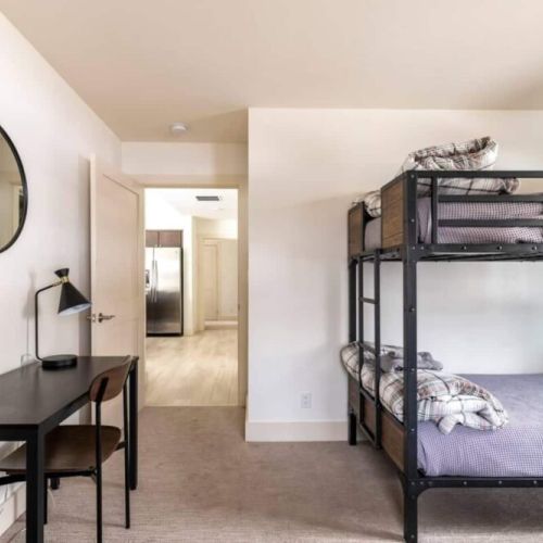 Bedroom #2 has two twin-over-twin bunk beds, made in an attractive mountain modern style.