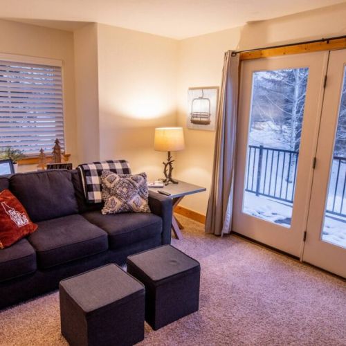 The living room also enjoys access to the front deck!