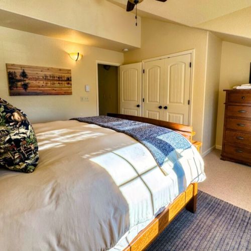 Bedroom #2 has a queen bed and plenty of storage space.