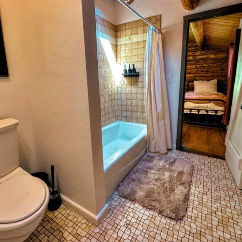 The Jack-and-Jill bathroom enjoys a tub/shower combo.