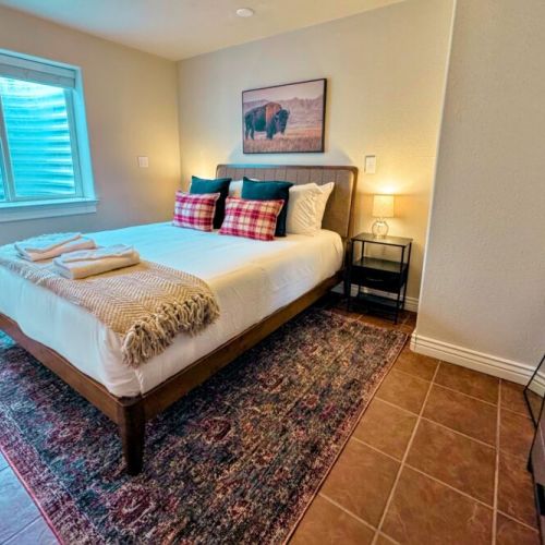 Bedroom #4 features a queen bed and a clothing organizer with plenty of room for all your belongings.