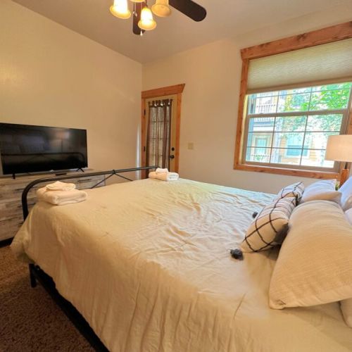 Bedroom #3 enjoys a queen bed and its own TV, as well as direct access out to one of the condo's two private decks.