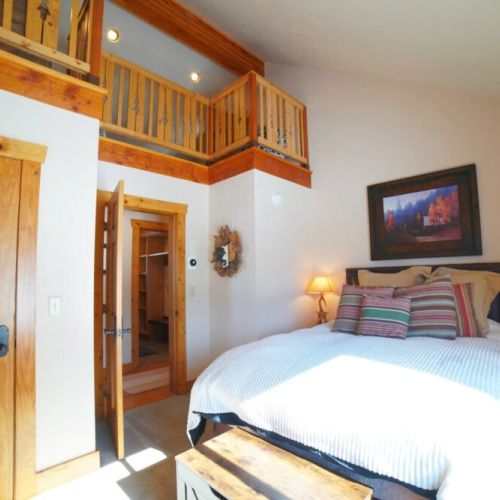 Bedroom #2, also on the main floor of the house, has a queen bed and has another lofted bedroom above it — perfect if you want to keep the kids close (but not too close).