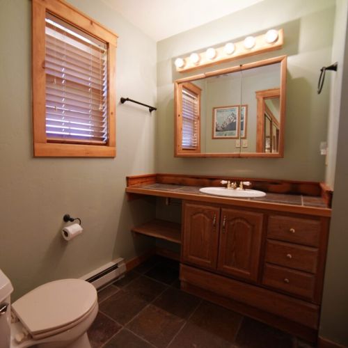 The master en suite bathroom has a lovely vanity and a tub/shower combo.
