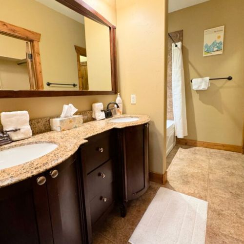 The en suite bath has a double vanity and a large tub/shower.