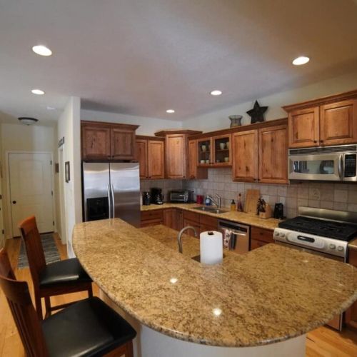Island in kitchen is perfect for serving the kids that early morning breakfast before hitting the slopes.