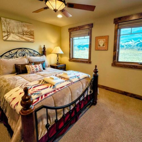 Bedroom #2 has a queen bed and an en suite bath — as well as a view of the Tetons.