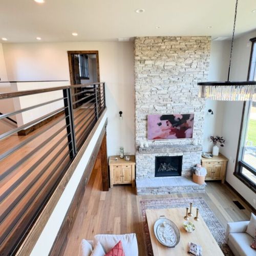 Guests staying on the second floor will always enjoy access to the action of the living space, as well as spectacular views out of the enormous windows.