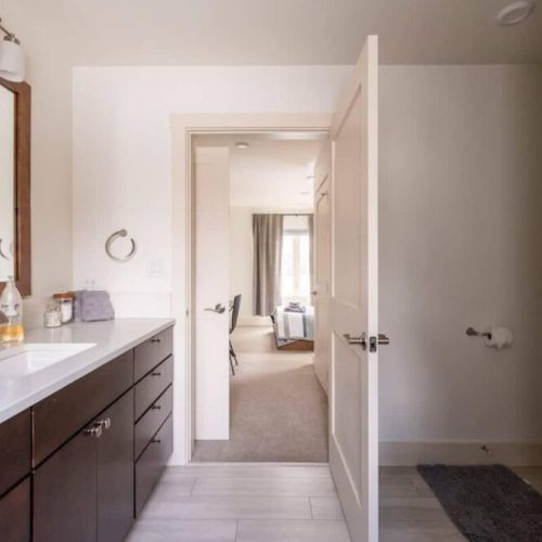 The en suite bath enjoys a spacious vanity and a walk-in shower.