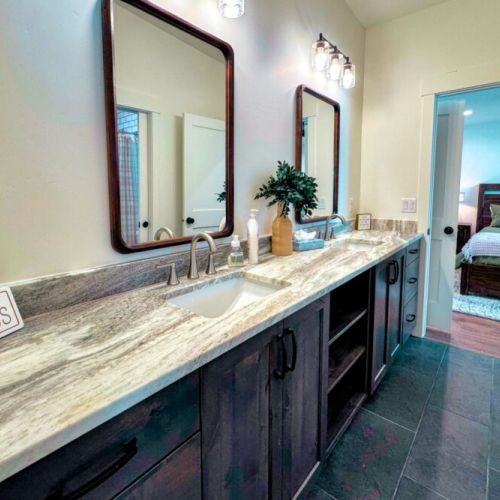 The Jack-and-Jill-style bathroom (shared by Bedrooms #2 and #3) features a double vanity and a tub/shower combo.