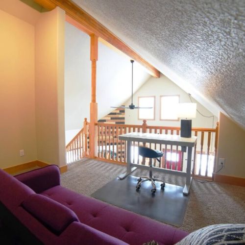 The upstairs common area has a sleeper sofa and a sit/stand desk, which is ideal for work- or school-from-home needs.