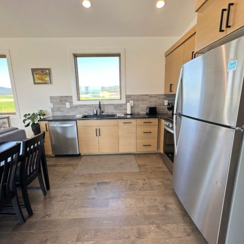 The kitchen is fully stocked and equipped with brand-new appliances — it is a breeze preparing any meal.