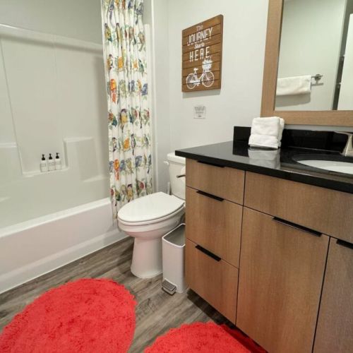 Bedrooms #2 and 3 share a full bathroom, with a large tub/shower combo and a spacious vanity.