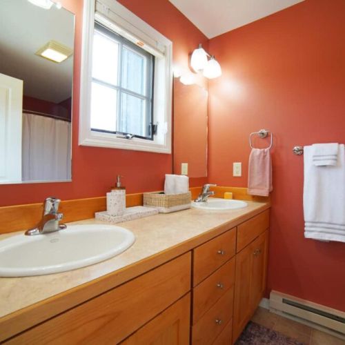 The master en suite has a double vanity and a large tub/shower combo.
