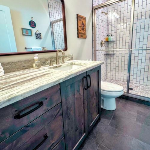 There is a third full bathroom on the main level, located off the entryway.