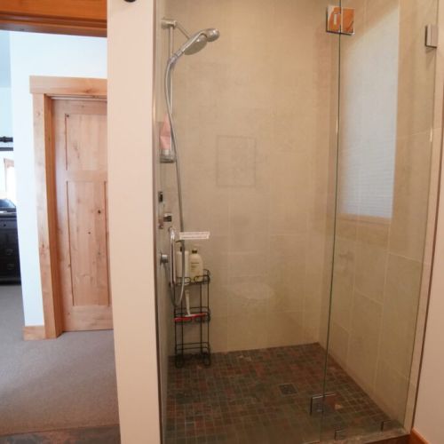The en suite bath has a lovely vanity and walk-in shower.