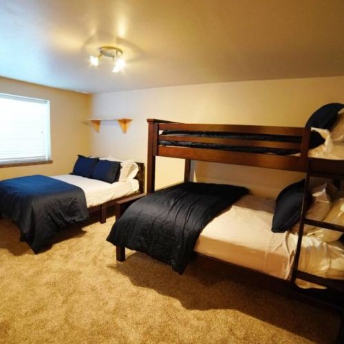Bedroom #4 in the lower level has a twin-over-queen bunk bed, a full bed, and loads of closet space!