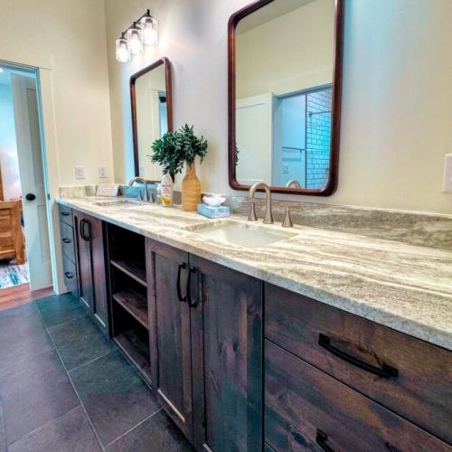 The Jack-and-Jill-style bathroom (shared by Bedrooms #2 and #3) features a double vanity and a tub/shower combo.