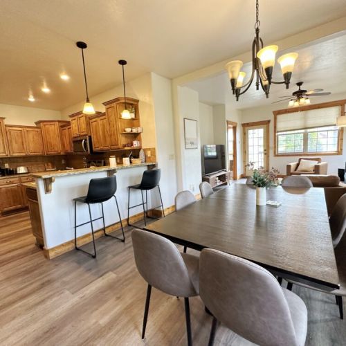 Whether you are cooking in the kitchen, eating at the dining table, or lounging in the living room, the open layout means you can always be a part of the fun in this condo.