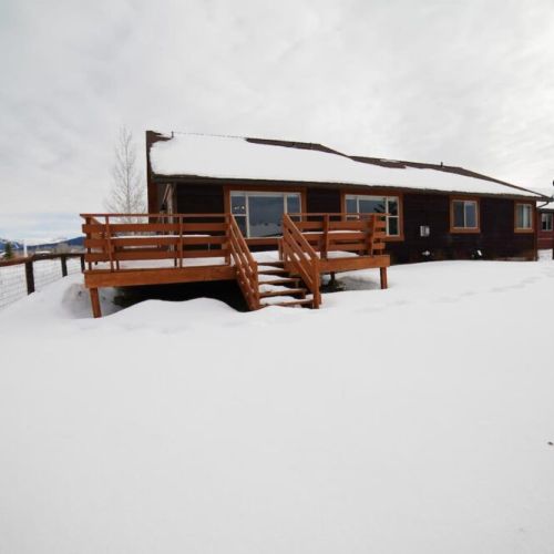 The fenced-in backyard is perfect for kids or pets, and it even has a deck!