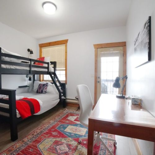 Bedroom #3 has a twin-over-full bunk bed — perfect for kids! And if you are working or schooling from home, be sure to make use of the dedicated workstation.