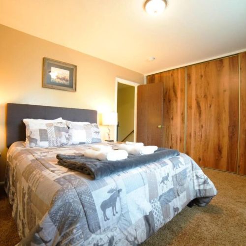 The master bedroom enjoys a queen bed and its own TV (also with Roku), as well as a dresser and a large closet.
