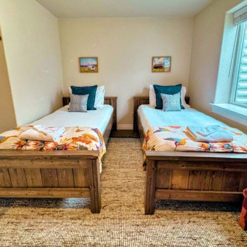 Bedroom #5 comes with two twin beds and some fun decor — perfect for kids!