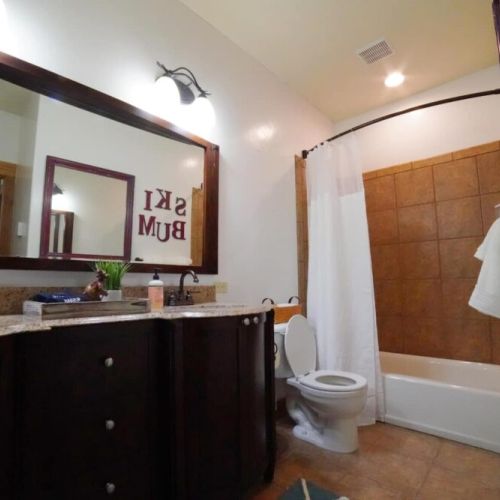 Bedrooms #2 and #3 share a bathroom, which has a double vanity and a large tub/shower combo.