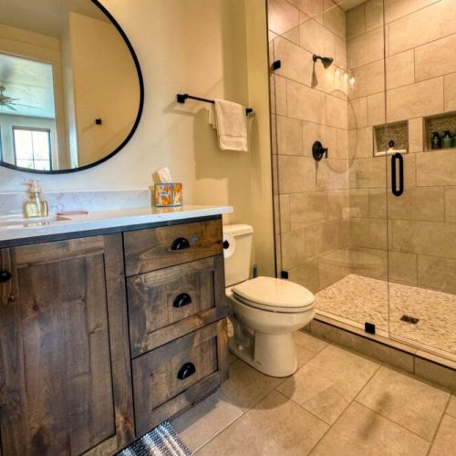 The entertainment room has an en suite with a walk-in shower.