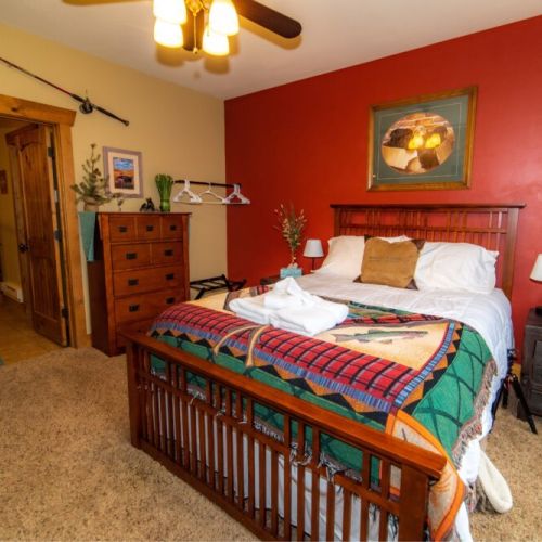 The master bedroom enjoys a queen bed, as well as a private en suite bath.