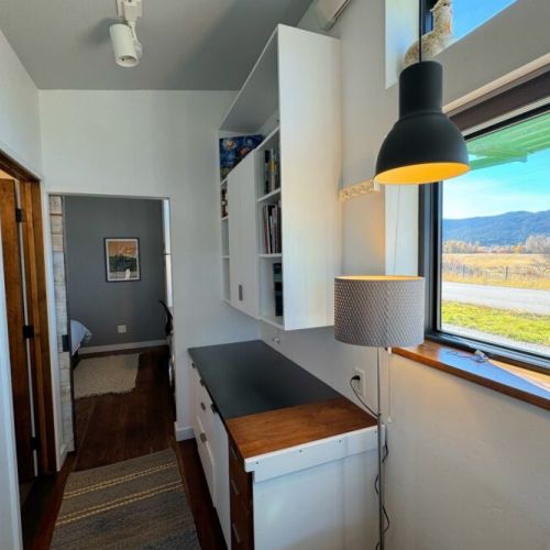 The west-facing windows offer stunning views of the Big Hole Mountains.