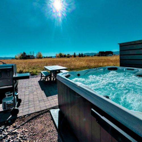 Relax on the back patio by soaking in the hot tub or cooking something up on the propane grill!