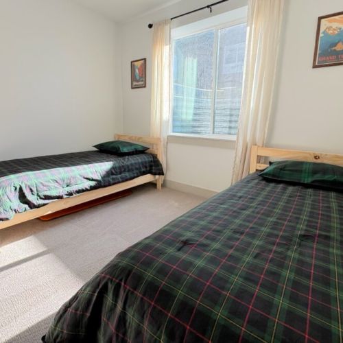 Bedroom #5 has two twin beds — perfect for kids!