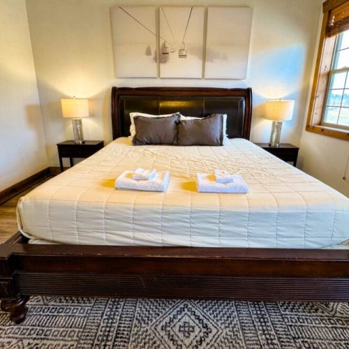 The master bedroom enjoys a king bed and an en suite bath.