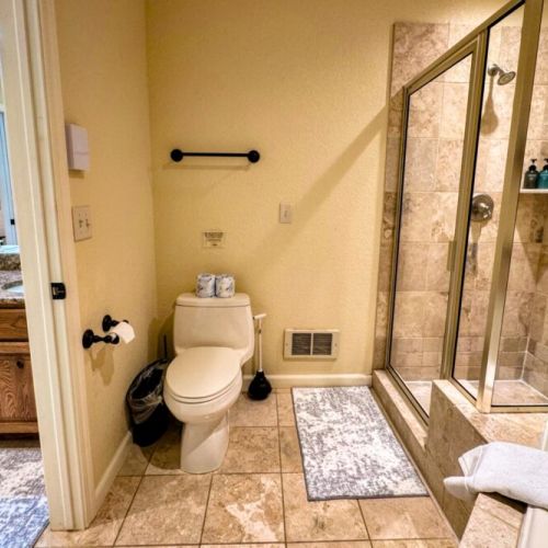 The primary en suite enjoys a spacious double vanity, a walk-in shower, and a large tub.
